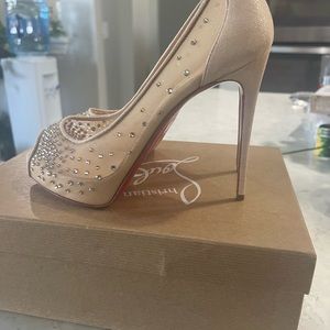 Christian Louboutin heels, never worn.